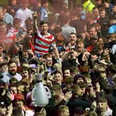 Doncaster Rovers' Harry Clifton in the thick of the promotion celebrations against Bradford City last month. Picture: Jonathan Gawthorpe