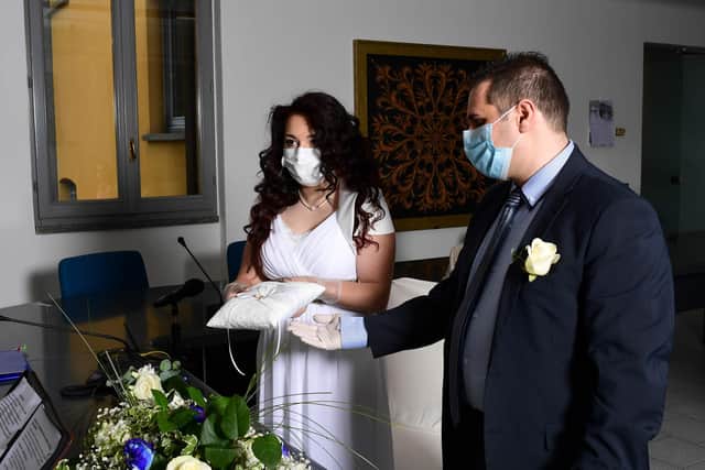 A wedding takes place in Italy during the coronavirus pandemic (Photo by MIGUEL MEDINA/AFP via Getty Images)
