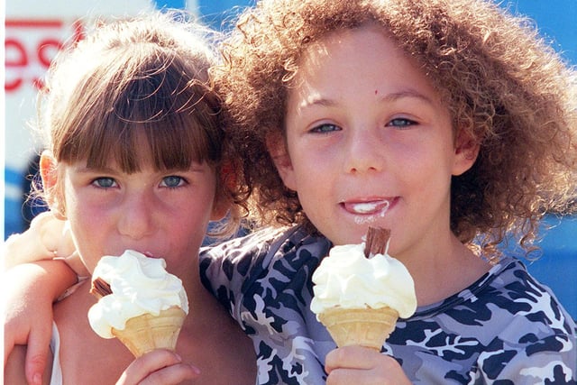 Samantha, five, and Tanya Bowden, seven, from Gleadless, enjoy ice creams in the sun in 1999