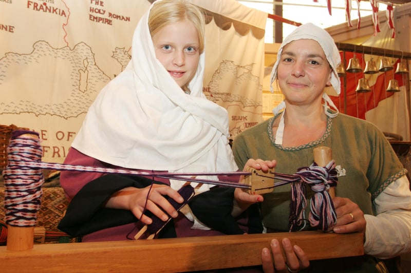 Freya Undrell gets a lesson on medieval Tablet Weaving from Helen Heavisides at Chsterfield Museum in 2009