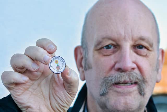 Cancer survivor Paul Gilligan with his badge