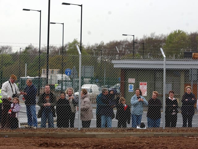 Plane watchers at Robin Hood airport stood around the fencing as the first flight prepares for take off.