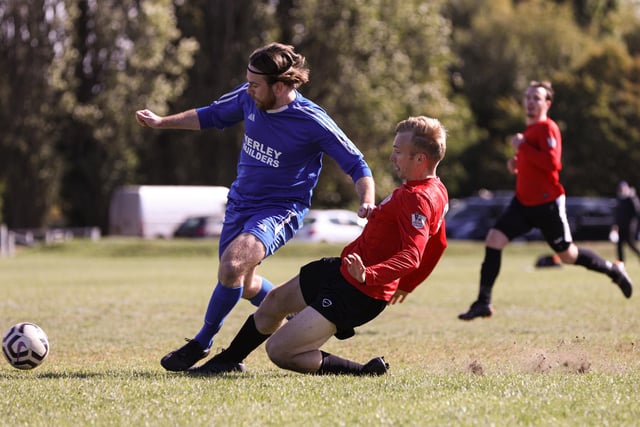 Wymering's Jamie Hayden, right, slides in to tackle Frankie Scott of FC Strawberry. Picture: Chris Moorhouse