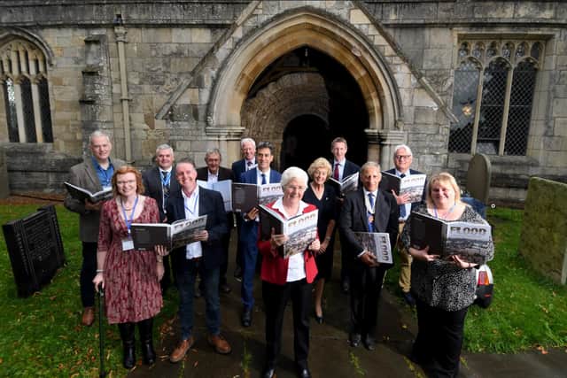 A book marking the Fishlake floods was launched at St Cuthbert's Church Fishlake. Doncaster MP Ed Milliband and Dan Jarvis join residents and the management team on September 19 2021