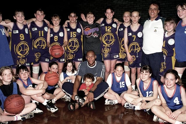 Pictured are members of two Doncaster girls basketball teams, The Panthers and Doncaster, along with former Sheffield Sharks player Garnet Gayle (centre) who came along to the Adwick Sports Centre to lend his support for a Girls U13 North of England Basketball Tournament in May 1997