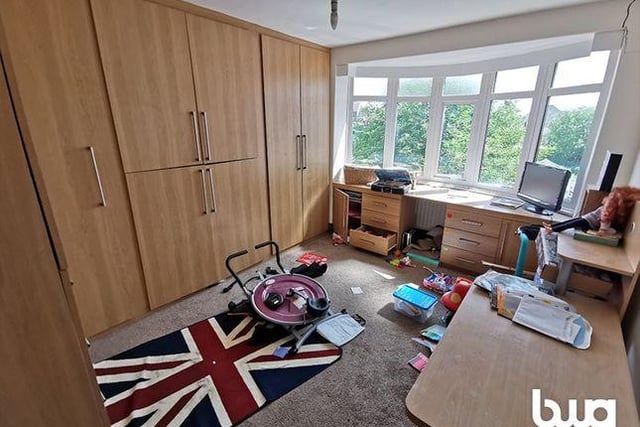 Overlooking the back garden, the property's second bedroom also comes with fitted wardrobes.