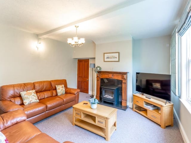 A lounge, or snug, with feature fireplace.