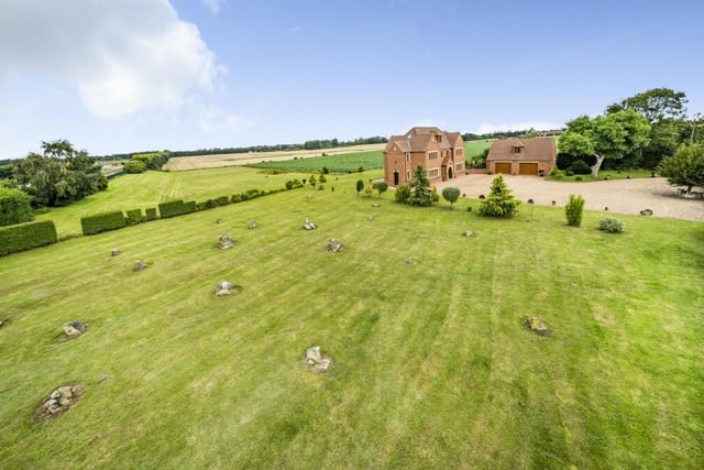 Looking towards the detached property from its three acres of grassland.