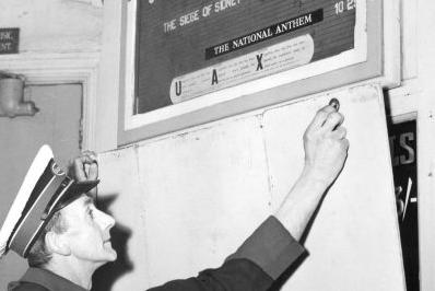 Staff member Edwin Causer puts the shutters up for a final time in 1961