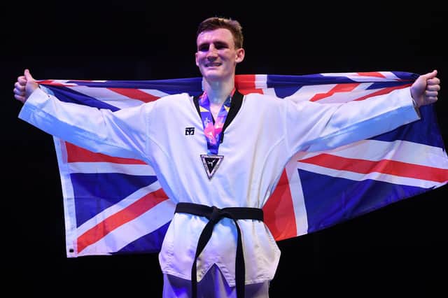 Bradly Sinden celebrates winning gold at the World Taekwondo Championships in 2019. Photo: Laurence Griffiths/Getty Images