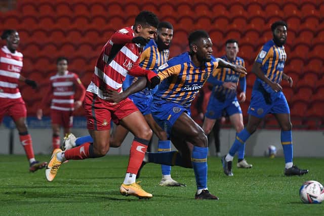 Tyreece John-Jules battles with Shrewsbury Town goalscorer Aaron Pierre. Picture: Andrew Roe/AHPIX