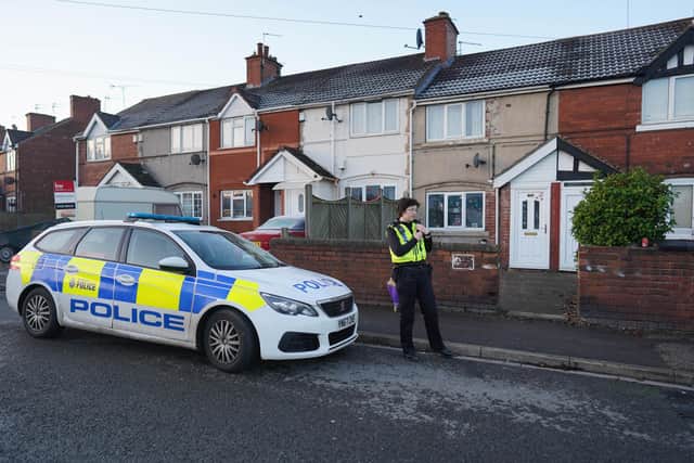 A police cordon remains in place at the house. Picture: SWNS