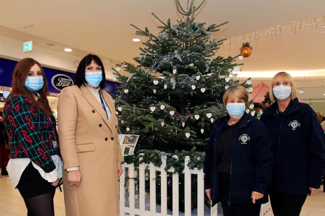 Pictured by the Cancer Detection Trust Memory Tree in the Frenchgate Shopping Centre are Abby Jackson, Marketing Executive, Karen Staniforth, Centre Manager, Thorne Rural Lions Club members, Auriol Henton, Zone Chairman and Pat Hammond. Picture: NDFP-07-12-21-MemoryTree 1-NMSY