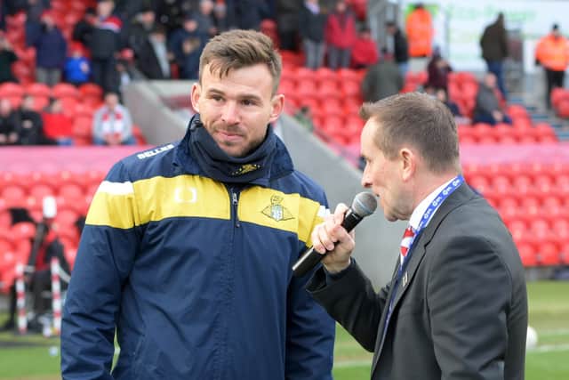 Doncaster Rovers Belles boss Andy Butler talks to Rovers announcer Jonathan Heath at the Eco-Power Stadium. Picture: Howard Roe/AHPIX LTD