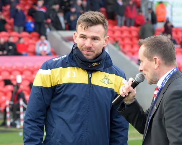 Doncaster Rovers Belles boss Andy Butler talks to Rovers announcer Jonathan Heath at the Eco-Power Stadium. Picture: Howard Roe/AHPIX LTD