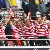 Doncaster Rovers celebrate their promotion to the Championship after victory in the play-off final against Leeds United at Wembley