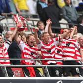 Doncaster Rovers celebrate their promotion to the Championship after victory in the play-off final against Leeds United at Wembley