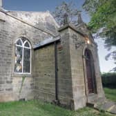 The former chapel has listed status and, at the top of its main front, bears a plaque with the inscription 'Wesleyan 1806'.