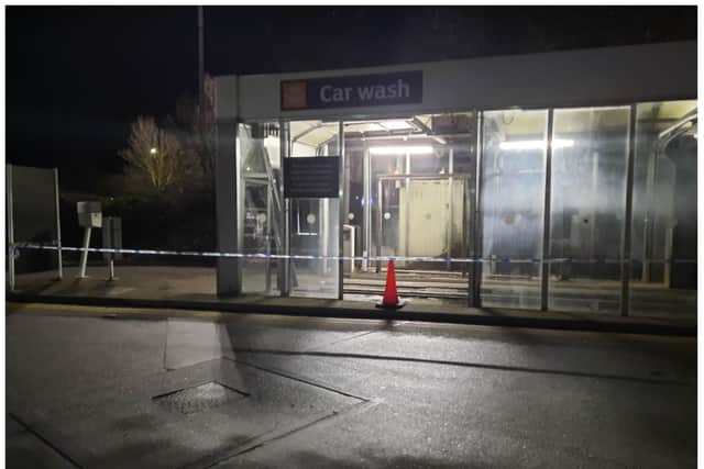 The car wash was badly damaged and cordoned off with police tape.