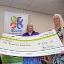 Gemma and Karen from Barratt and David Wilson Homes presenting SCCCC with their cheque.