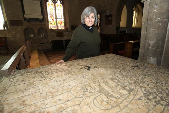 St Laurence's Church in Adwick-Le-Street has a tomb of James Washington in the chapel. The tomb is covered in stars and stripes and the family coat of arms is the inspiration for the USA flag. Pictured is Rev Ann Walton with the tomb.