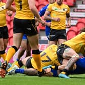 Mahe Fonua scores for the Dons. Picture: Howard Roe/AHPIX.com