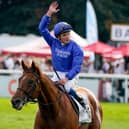 William Buick celebrates after riding Hurricane Lane to victory in the Cazoo St Leger Stakes at Doncaster. Photo by Alan Crowhurst/Getty Images