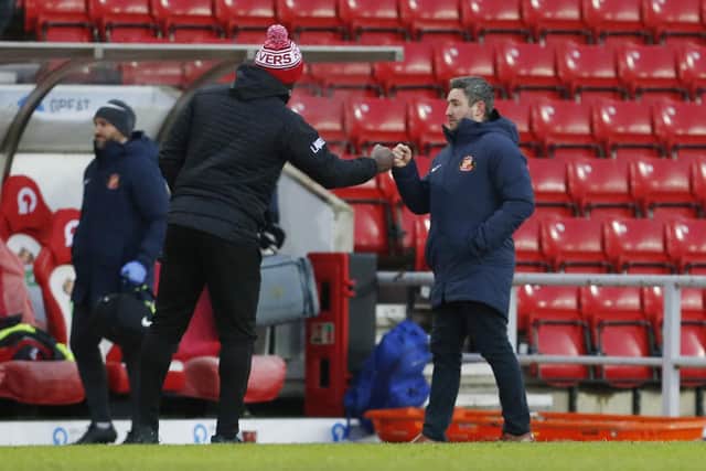 Darren Moore with Sunderland boss Lee Johnson. Picture: Craig Brough/AHPIX