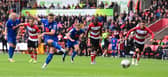 Harrogate Town's Jack Muldoon scores a penalty past Doncaster Rovers' Ian Lawlor.