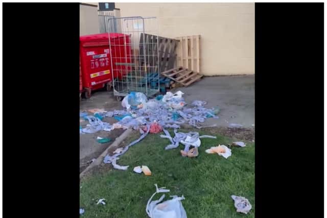 Video footage shows rubbish strewn at the rear of business premises in Lakeside.