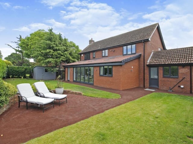 A lovely lawned garden to the rear, with patio seating spaces.