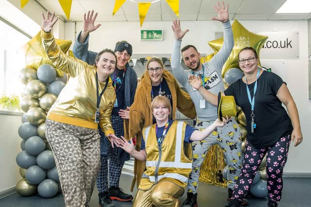 Staff wore pyjamas to raise money for charity. Pictured are Caroline Compson-Price (kneeling) with (l-r) Ieva (correct) Baltace, Stephen Day, Site Manager Kris Hammond, Egons Jamkins and Justyna Wiley