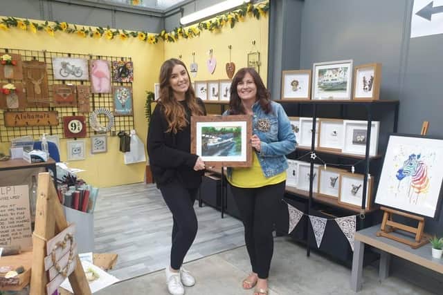 Sophie (left) and Vicky Harrington with the Lady Wyre painting.