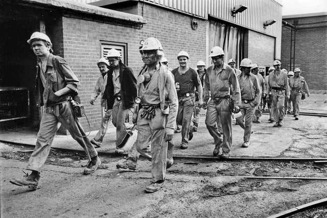 Miners leave the Yorkshire Main Colliery after their last shift before closure of the mine in October 1985