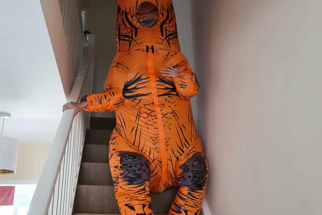Saffron Livsey in her dinosaur costume