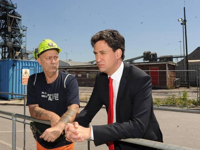 Ed Miliband MP chats with Dennis Crew during his visit to Hatfield Colliery near Doncaster on the day it was announced it is to close.Picture Scott Merrylees