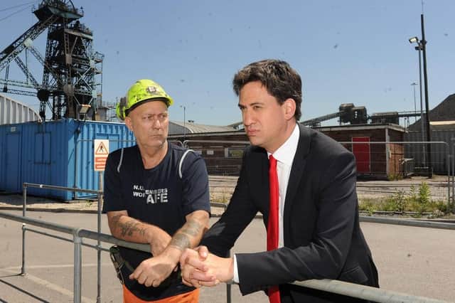 Ed Miliband MP chats with Dennis Crew during his visit to Hatfield Colliery near Doncaster on the day it was announced it is to close.Picture Scott Merrylees