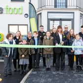 Children from Shaw Wood Academy join Store manager Lyn Hunter and her team, as well as Councilor Tim Needham from Doncaster Council to cut the ribbon