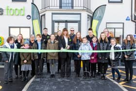 Children from Shaw Wood Academy join Store manager Lyn Hunter and her team, as well as Councilor Tim Needham from Doncaster Council to cut the ribbon