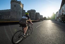 A courier delivers a copy of the Racing Post at Windsor Castle on the resumption of horse racing in Great Britain. Pic: Edward Whitaker