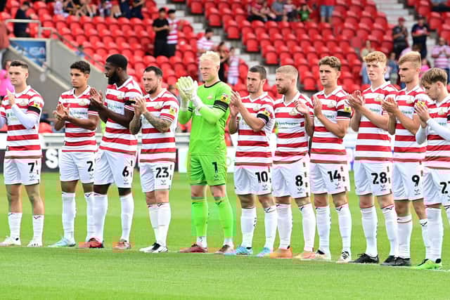 Doncaster Rovers players applaud former manager Sammy Chung ahead of kick-off against Mansfield Town.