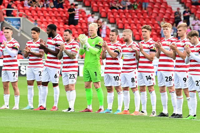 Doncaster Rovers players applaud former manager Sammy Chung ahead of kick-off against Mansfield Town.