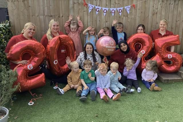 Team members and children at Partou Woodlands House celebrating their success