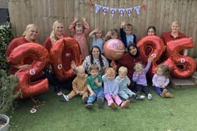 Team members and children at Partou Woodlands House celebrating their success