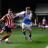 Sheffield United's Billy Sharp is tackled by Joe Tomlinson of Peterborough United. Photo: David Klein/Sportimage.