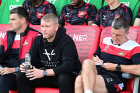 Doncaster manager Grant McCann (centre), his assistant Cliff Byrne (right) and goalkeeper coach Kyle Letheren.