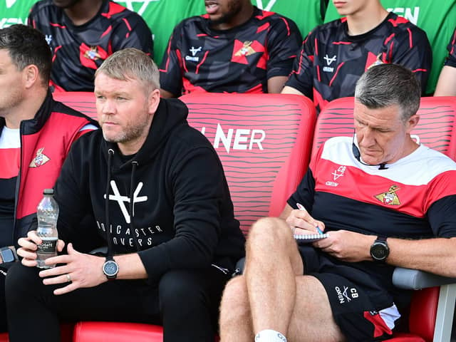 Doncaster manager Grant McCann (centre), his assistant Cliff Byrne (right) and goalkeeper coach Kyle Letheren.