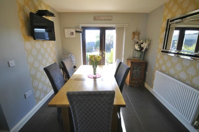 The dining room has double doors out to the garden.