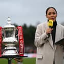 KETTERING, ENGLAND - DECEMBER 01: Pundit, Alex Scott stands with the FA Cup Trophy prior to the Emirates FA Cup Second Round match between Kettering Town and Doncaster Rovers at Latimer Park on December 01, 2024 in Kettering, England. (Photo by Shaun Botterill/Getty Images)