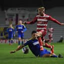 Josh Sims skips past AFC Wimbledon's Will Nightingale. Picture: Howard Roe/AHPIX
